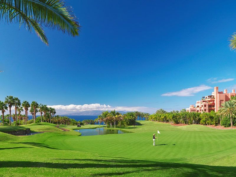 golf course in spain,right next to a hotel, palm trees, smalll lake, huge fairway, golf vacation, holidays on the canary islands