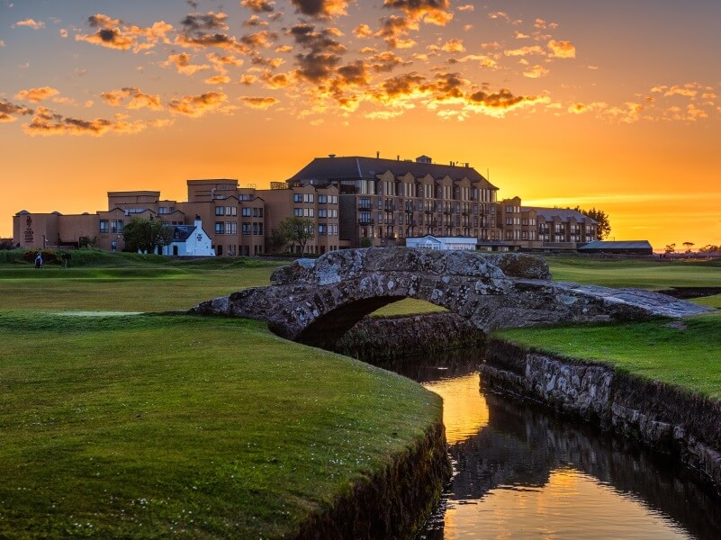 Old Course St. Andrews, golf course, stone bridge, club house, river, orange sky, golf trip, holidays in scotland
